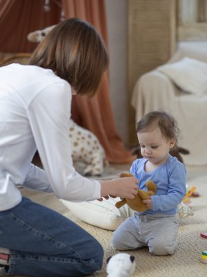 medium-shot-mother-cute-baby-home